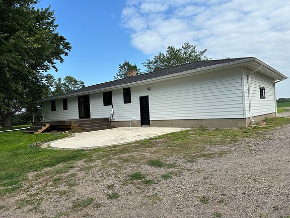 Back of home with cement patio, and new decking. Railing are being installed on the deck shortly!