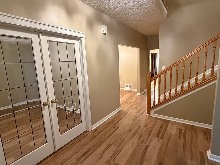 Foyer with French door to the den/office.