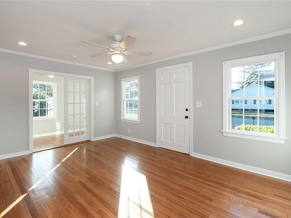 The opening with the french doors could be a nice sun room or a great home office.