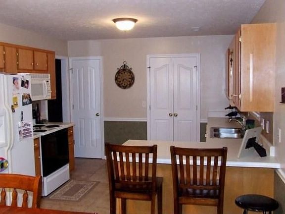 Huge kitchen opens into living room--GREAT Traffic flow for parties & kids!