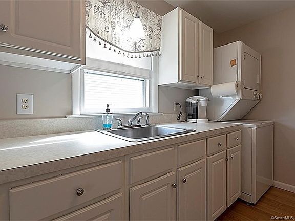 Light filled kitchen with stackable laundry area