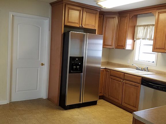Big door goes to the laundry room. Small door is a pantry.