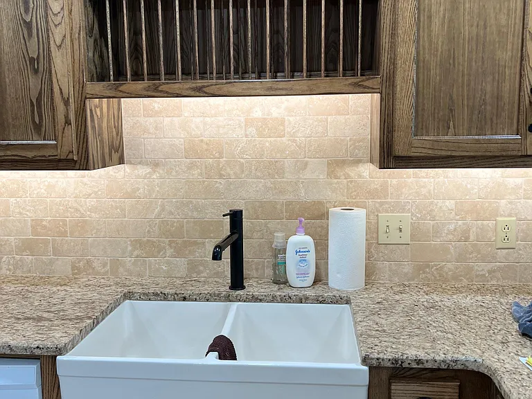Farmhouse sink with plate rack above