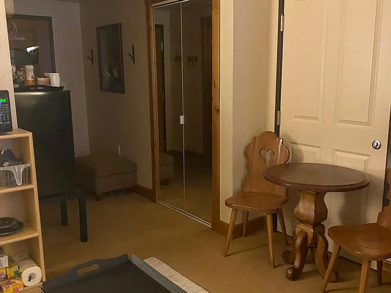 Kitchenette, mini frig, table and chairs.