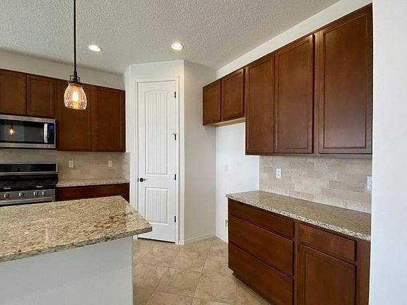 Spacious corner pantry offers plenty of storage