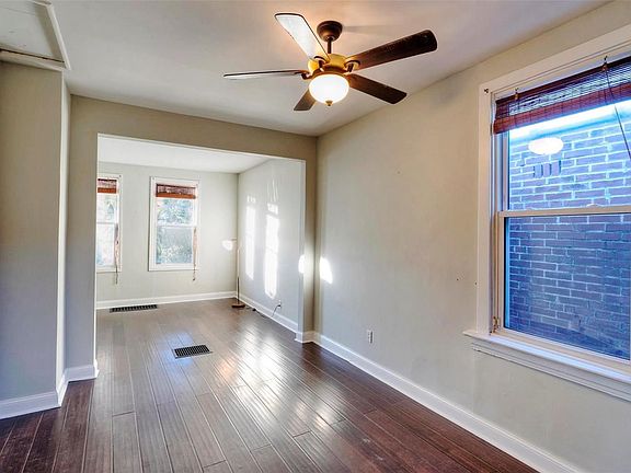 Dark hand-scraped bamboo flooring, fresh paint and replacement windows throughout.