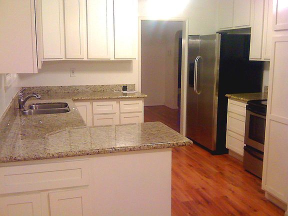 Updated eat-in kitchen with slab granite