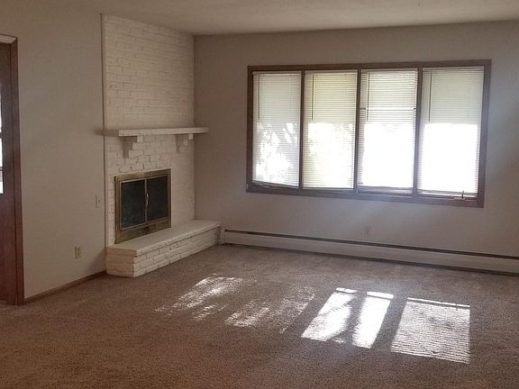 Upper level large living room w/fireplace.