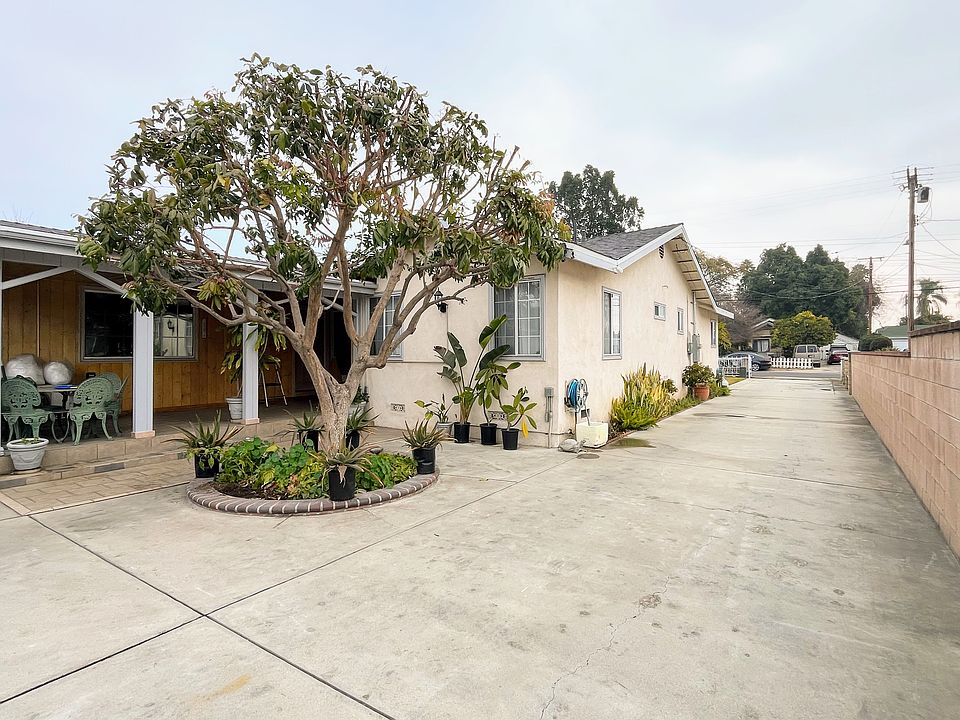 Main house, with gated driveway.