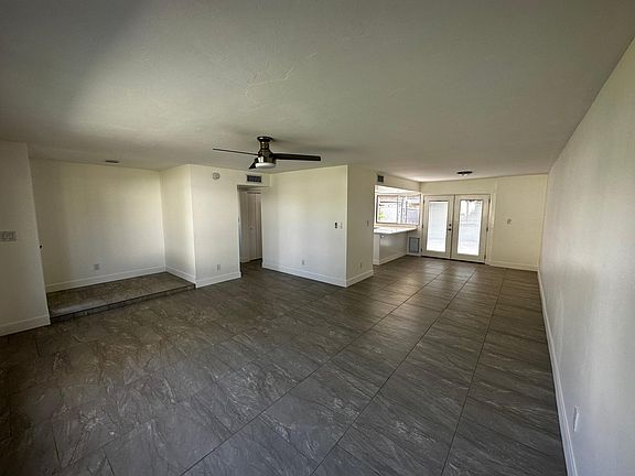 Living Room flows to Kitchen area.