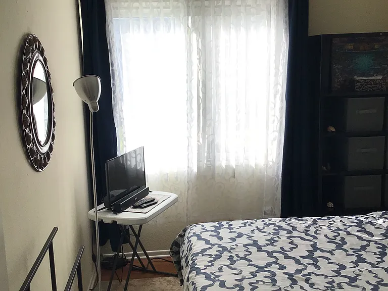 Room is clean, windows have blinds that can be fully opened or closed. Blue colored blackout curtains to keep light out.