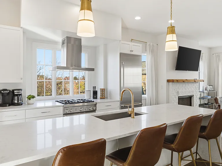 Fully equipped kitchen with stainless steel appliances, seating for 4 at the kitchen island, additional seating at the dining room table and all the dishware / utensils you might need.