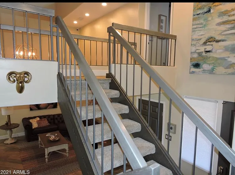 Stairs up to two bedrooms plus office/den