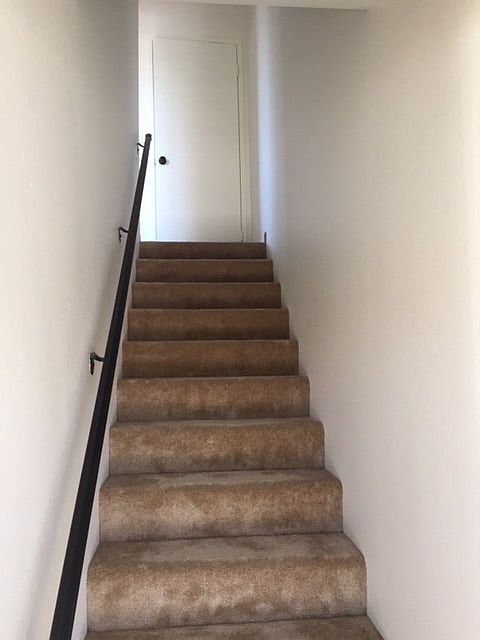 Carpeted stairs to bedrooms and bathroom