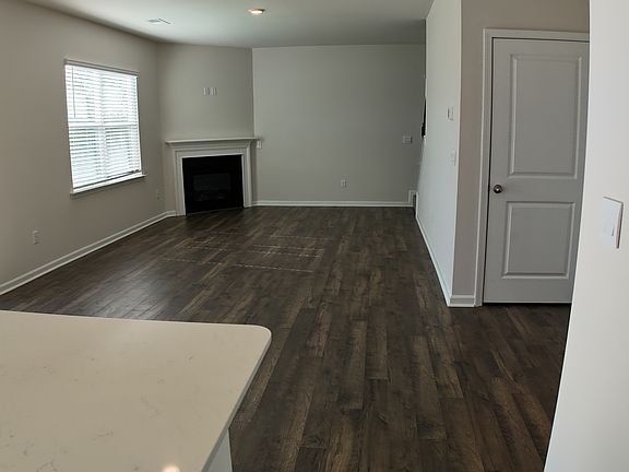 kitchen overlooks living room with fireplace