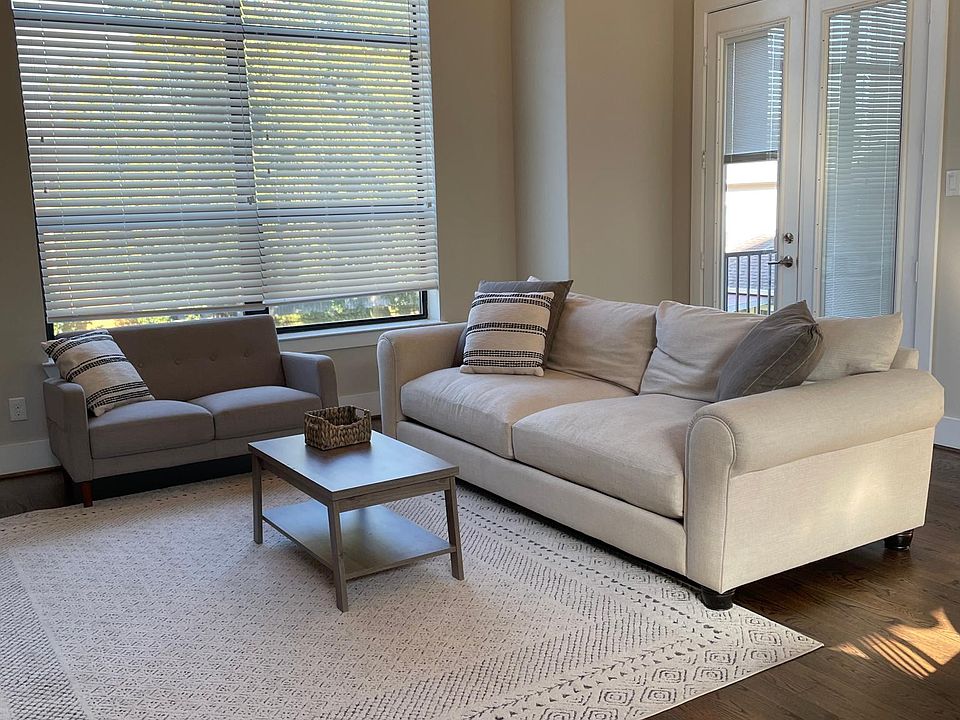 Open concept living space with 14' high ceilings on the second floor