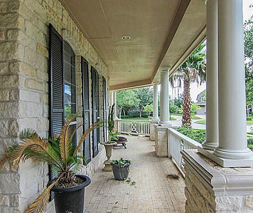 Gorgeous brick front porch extends across the entire front of the home.