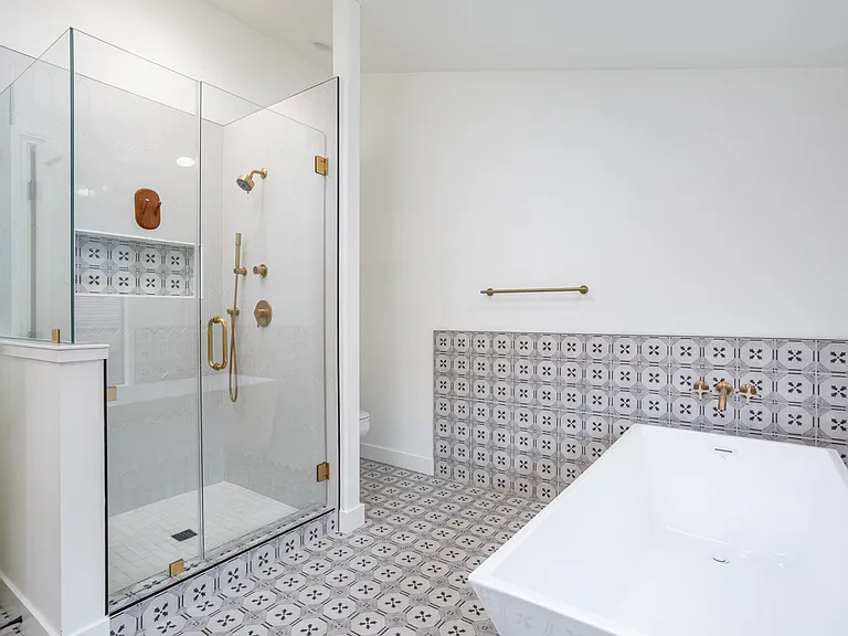 Tub and walk in shower in master bathroom.