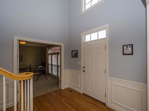 Open entry with updated lighting, lots of natural lighting