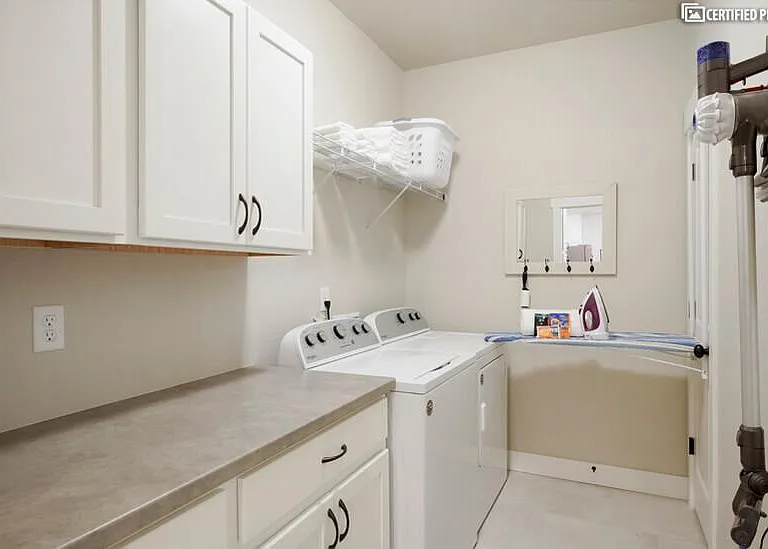 In-unit laundry with pull down ironing board & dyson vacuum