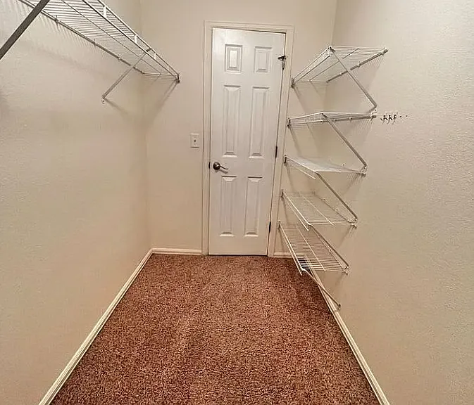 View of the master closet from the back of the closet.