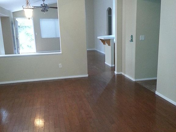 The living room. Love the arched doorway!