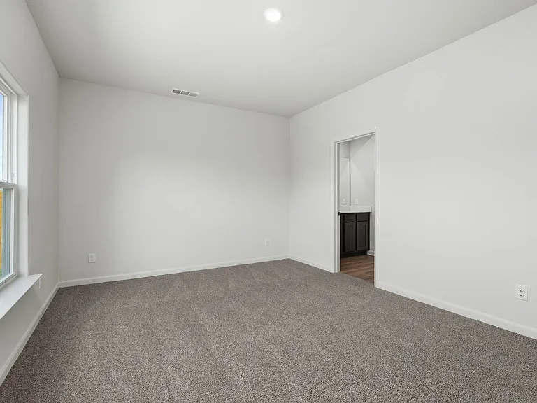The master suite has a large bedroom, ensuite bathroom and walk-in closet.