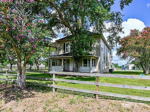 This charming horse farm has five acres and separated paddocks.