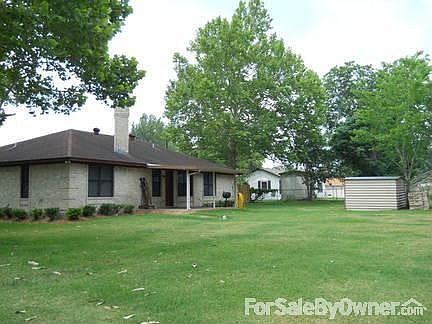 back view with covered cement patio