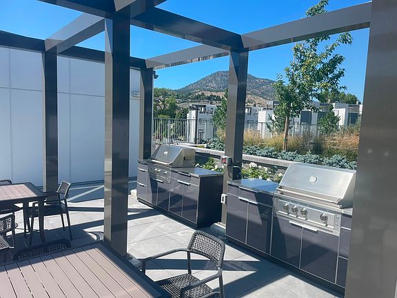 Poolside BBQ grills and tables