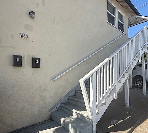 Unit is up the stairs and at the end of the walkway.