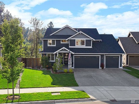 Front of house.  Sprinkler system with 16-zone smart panel, including sprinkler coverage of the boulevard area in front of home.