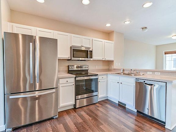 Kitchen with new stove, microwave and dishwasher