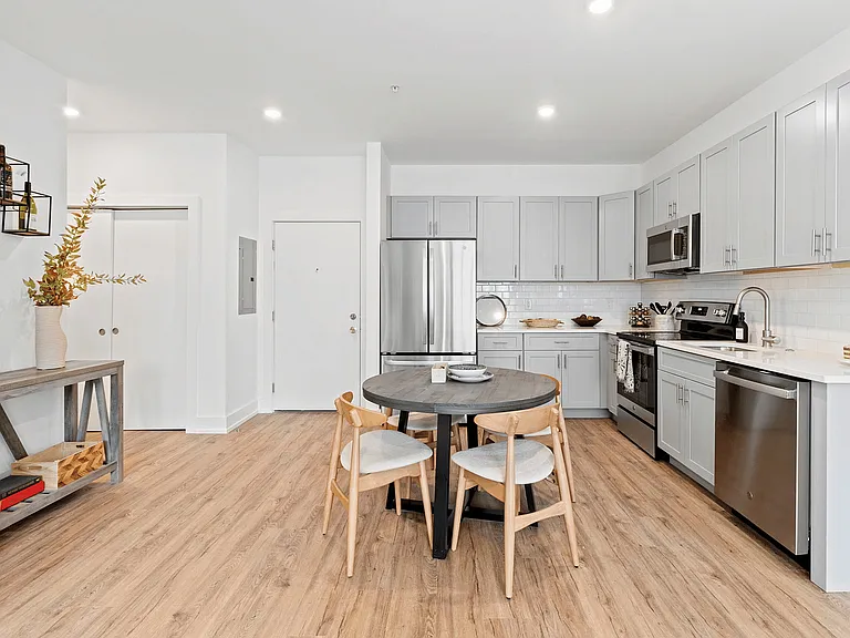 Experience contemporary elegance in this open-concept kitchen, perfect for stylish living.