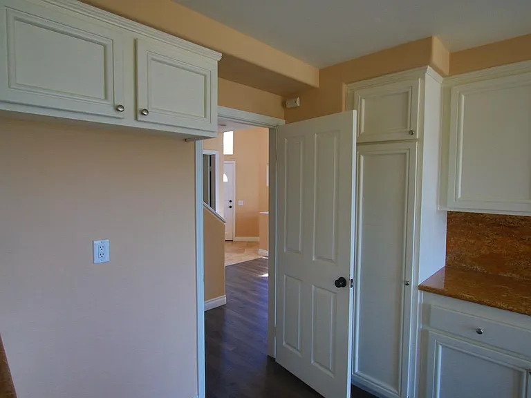 Kitchen and view of the hallway, stairs and bathroom