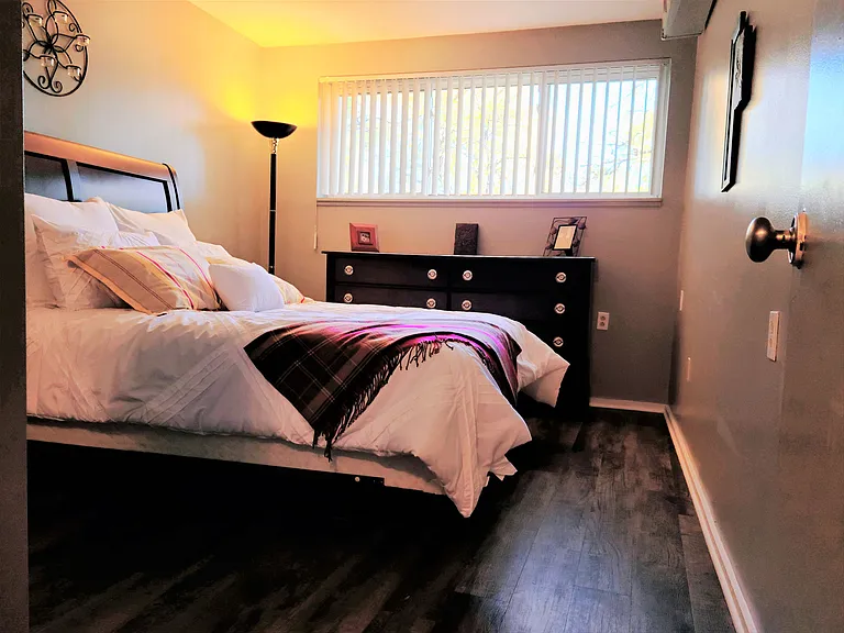 Bedroom With Wooden Flooring