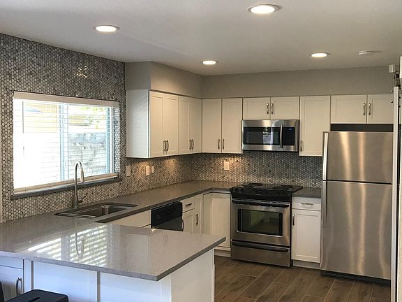 Kitchen with seating at breakfast bar