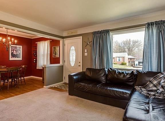 View of the front door and dining room from the living room