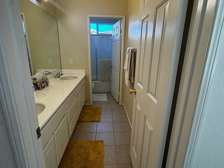 Bathroom rugs provided for tenant comfort