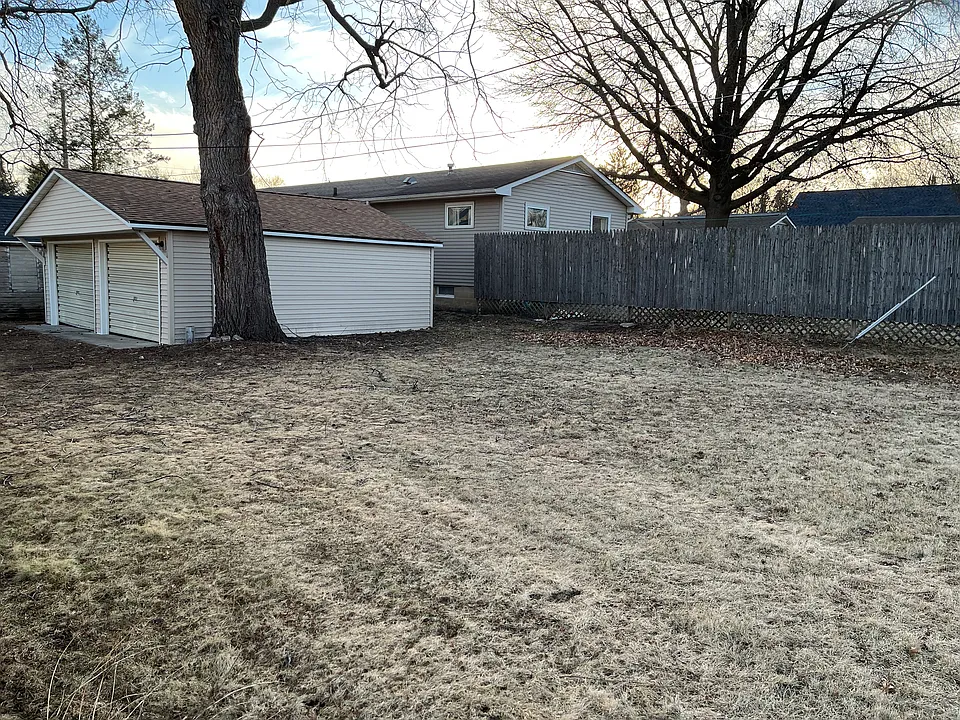 2 car shared garage and backyard