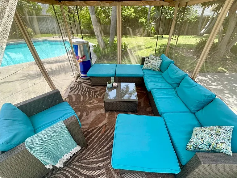 Outdoor cabana with couch and mini fridge (seasonal)