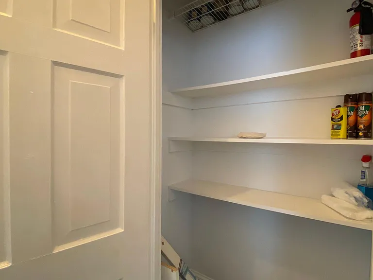 storage closet across from bathroom