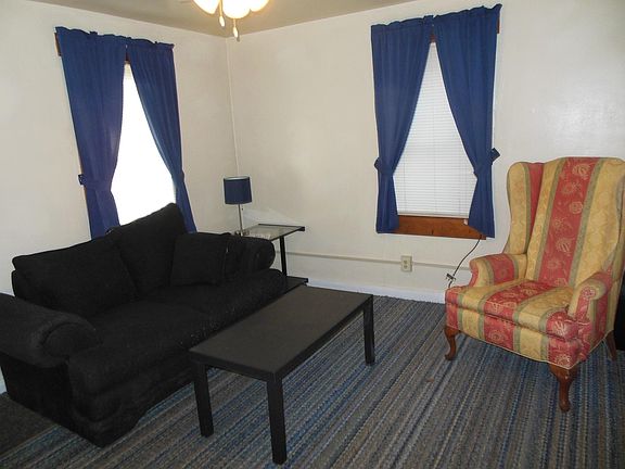 Living room:couch, chair, coffee table, bookcase