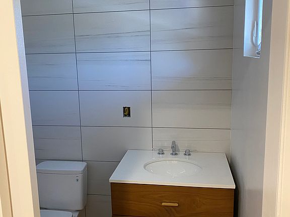 1/2 bath attached to bedroom 2