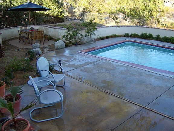 pool with mature shade trees.