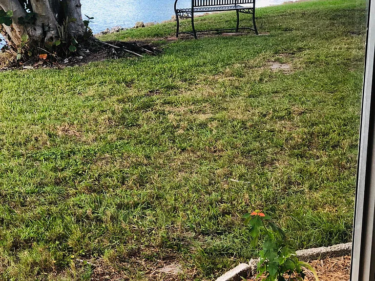 LAKE VIEWS FROM OWNERS BEDROOM FEATURING CLOSE PROXIMITY SITTING BENCH