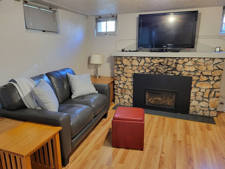 Living room. All furniture in picture includes - yes the TV. Internet & streaming box included in utility fee.