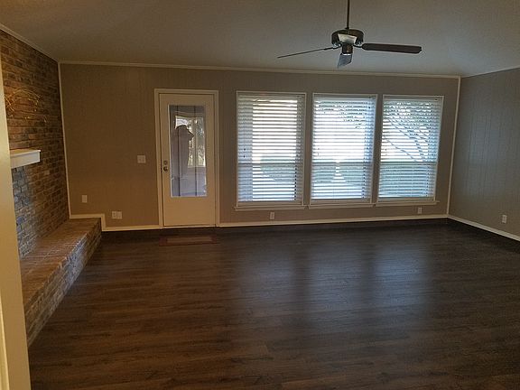 Wooded area behind house.