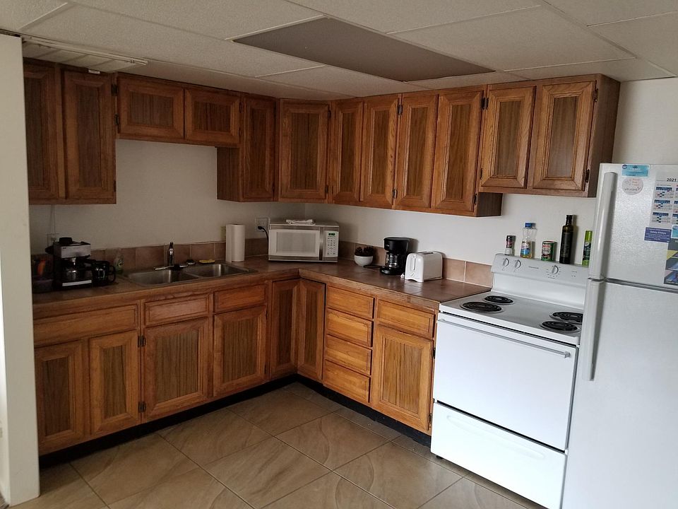 Large kitchen adjoining a dining room that sets up to 6.