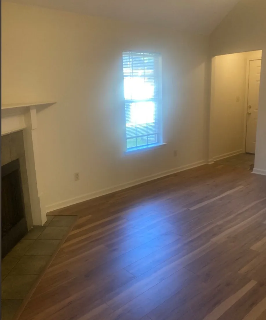 Living Room and kitchen has vaulted ceilings. Gas log fireplace in Living Room. New flooring and paint. - 10304 Tally Ho Dr